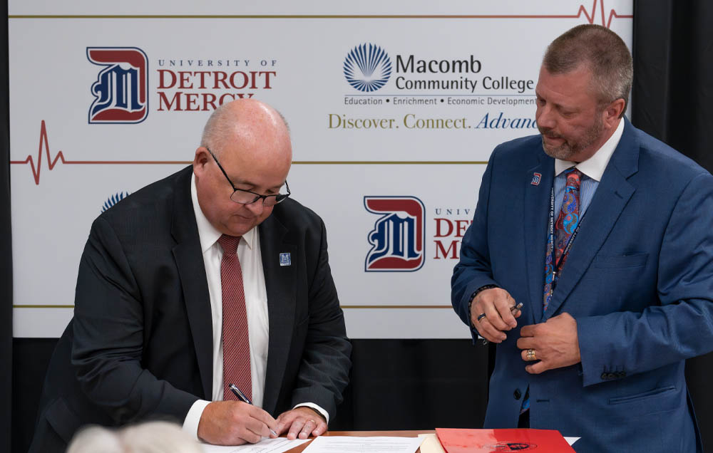 The signing of the agreement between Macomb Community College and University of Detroit Mercy brings a BSN completion program headquartered at the college's Center Campus in Clinton Township..